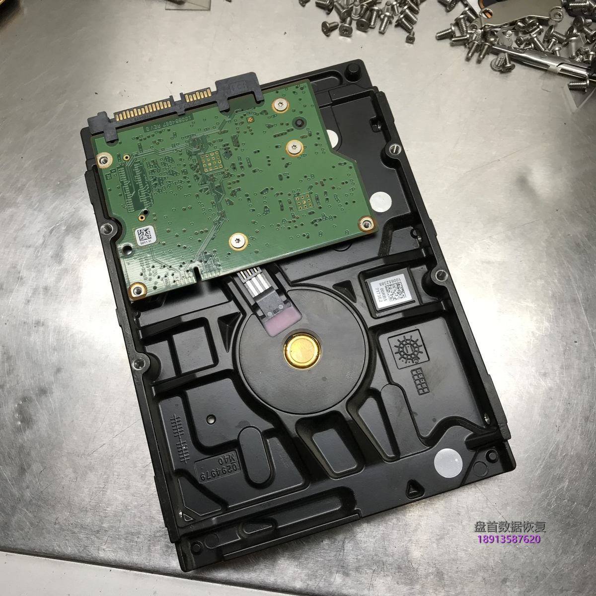 Seagate 1TB台式机硬盘通电磁头异响两声后停转更换磁头恢复数据成功