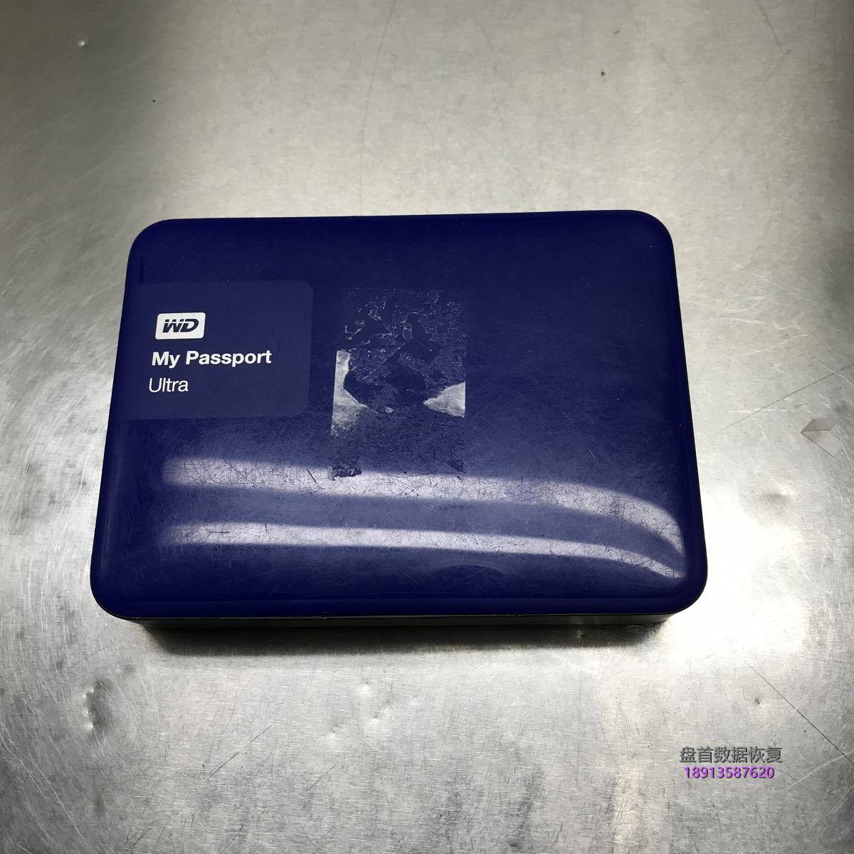西部数据移动硬盘My Passport Ultra接到电脑里打不开分区,点击盘符电脑卡死