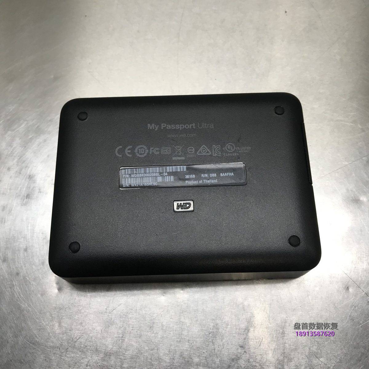 西部数据移动硬盘My Passport Ultra接到电脑里打不开分区,点击盘符电脑卡死